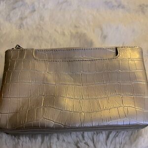 This is a large wallet with many cards compartments